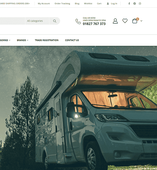 Motorhome in a lush green outdoor environment with trees and a starry sky background.
