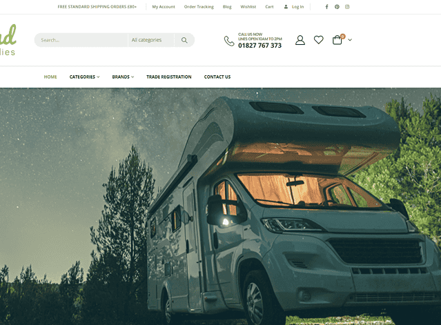 Motorhome in a lush green outdoor environment with trees and a starry sky background.